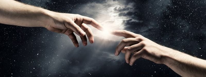 Two heavenly hands reaching towards each other.