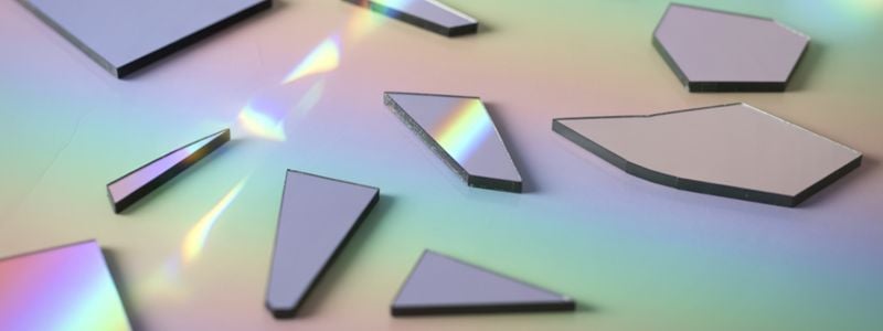 Shards of rainbow lit broken glass.