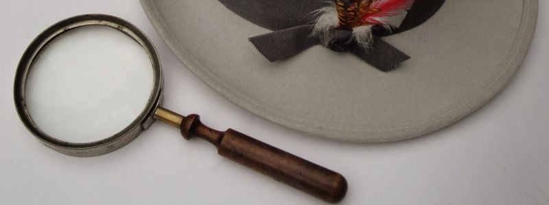 A hat and magnifying glass.