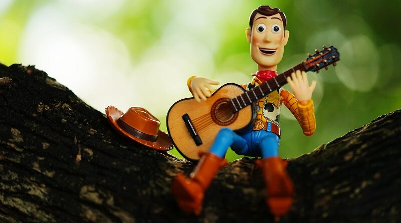 Woody playing the guitar.