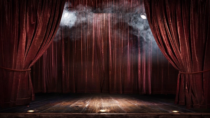 Theatre curtains and an empty stage.