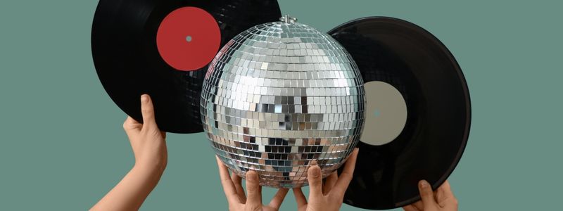A disco ball and two records.