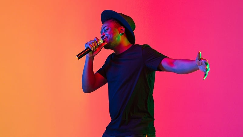 A singer in neon lights.