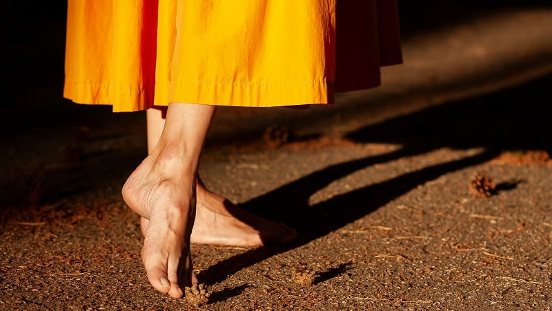 The bottom of a yellow dress.