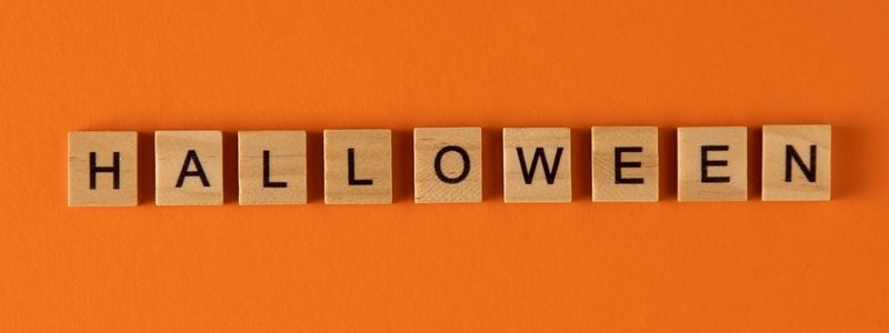 The word "Halloween" spelled with wooden tiles.