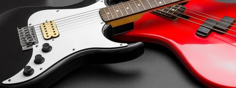 A closeup of two electric guitars.