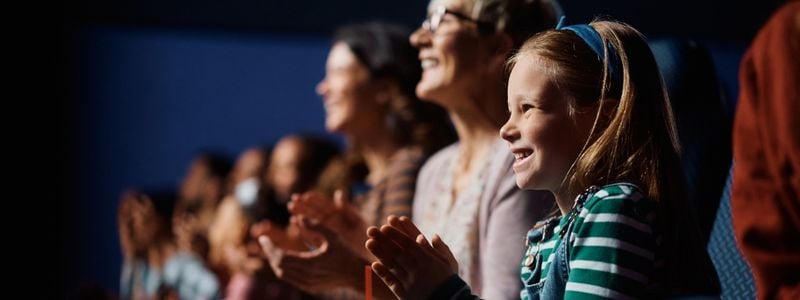 A child enjoying a musical.