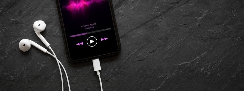 Music playing through headphones with an app.