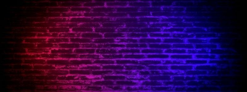 A neon brick stage wall.