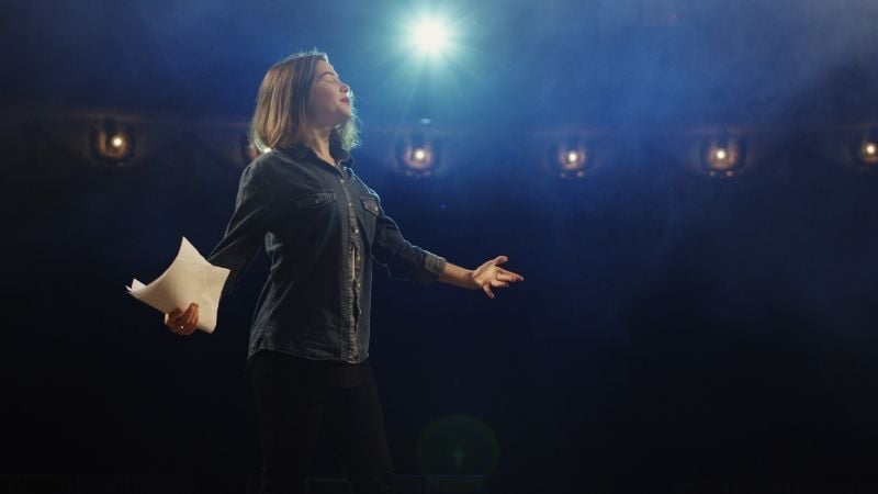 A female performer on stage.