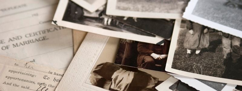 A pile of historical photos and documents.