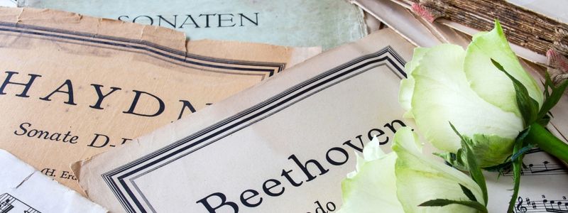 A pile of vintage classical sheet music.