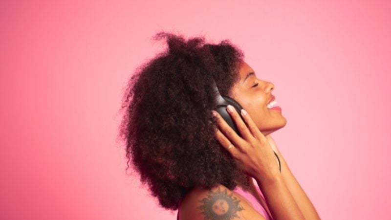 A woman listening to pop music.