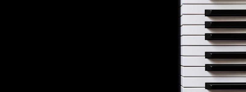 Sideways piano keys on a black background.