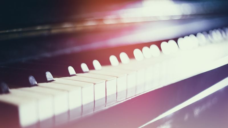 A purple lit piano.