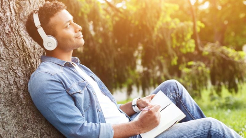 A man listening to music and dreaming.