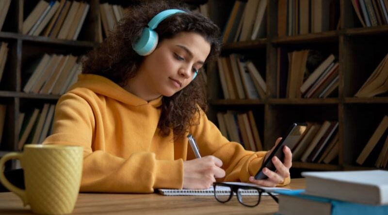 A college student listening to music.