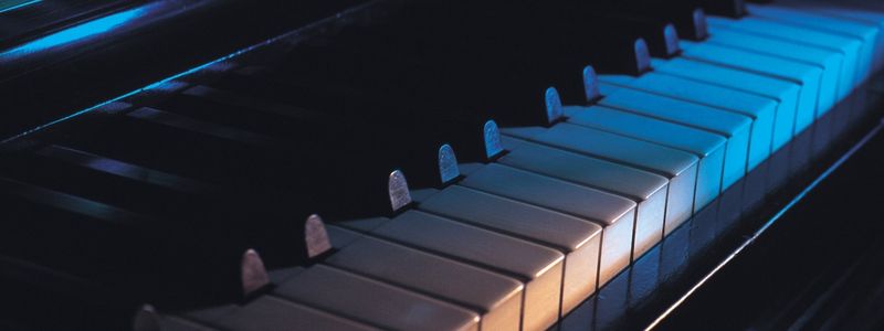 A blue lit piano.