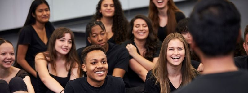 A group of actors in rehearsal.