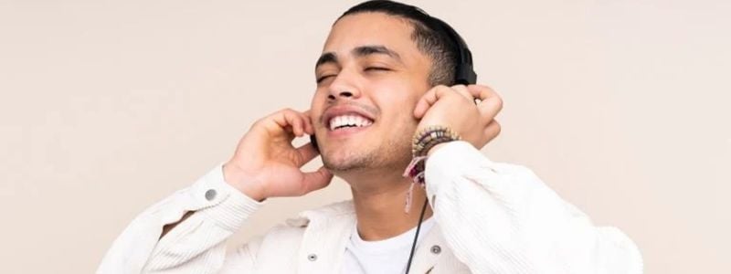 A man listening to music with headphones.