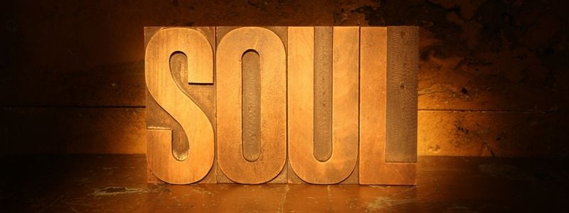 The word "SOUL" written with letter blocks.