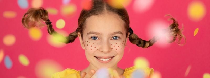 A girl with freckles and pigtails.