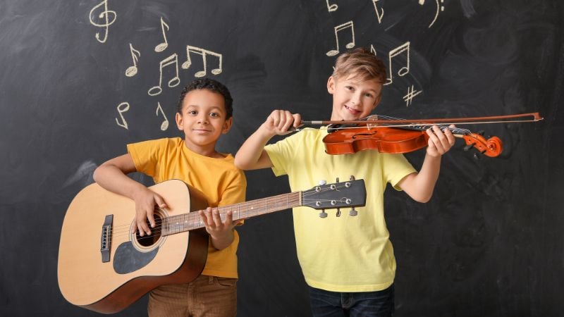 Two children playing music at school.