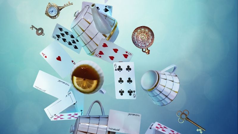 Cards, tea, and clocks falling through a space.