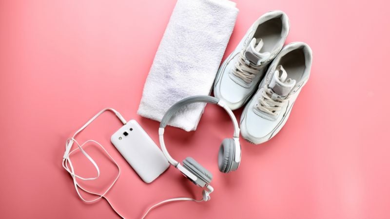 Sports shoes, towel, and headphones for music.