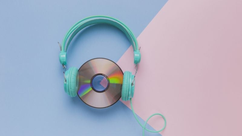 A CD with headphones wrapped around it.