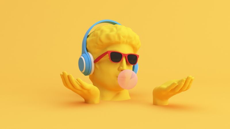 A yellow statue head with headphones and bubblegum.