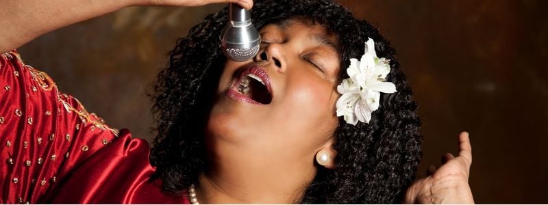 A gospel singer with a microphone.