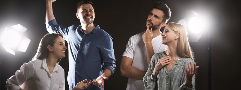 Four performers on stage.